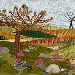 Textile art of a tree and moorland with a pheasant by Jackie Gale