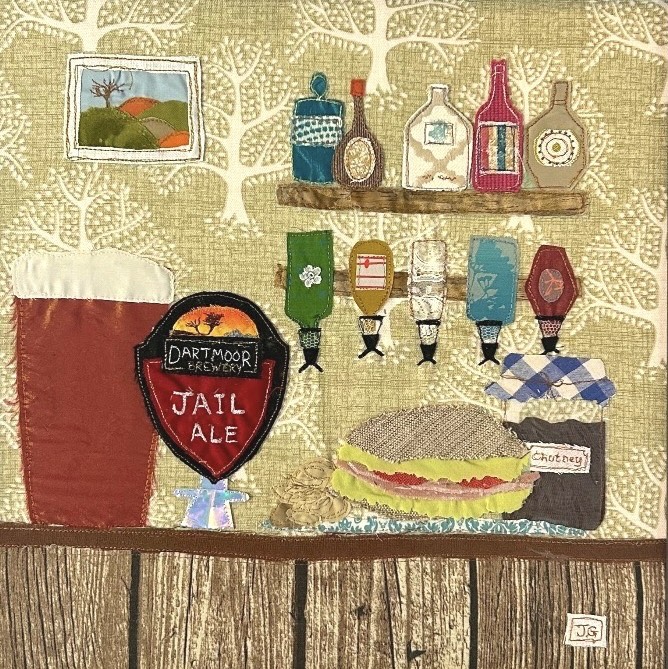 Textile art of a lunchtime pint by Jackie Gale. Available through Wildwood Art Gallery