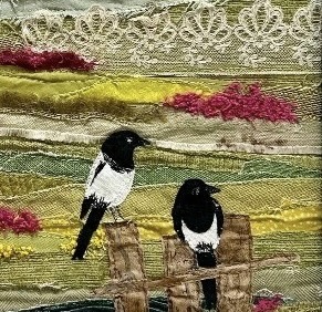 Two magpies on a fence in textile art by Jackie Gale, available through Wildwood Art Gallery on Dartmoor