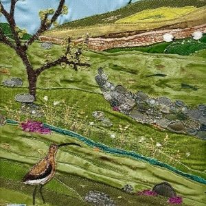 textile art of a curlew and a tree in a moorland landscape, by Jackie Gale, available through Wildwood Art gallery on Dartmoor.