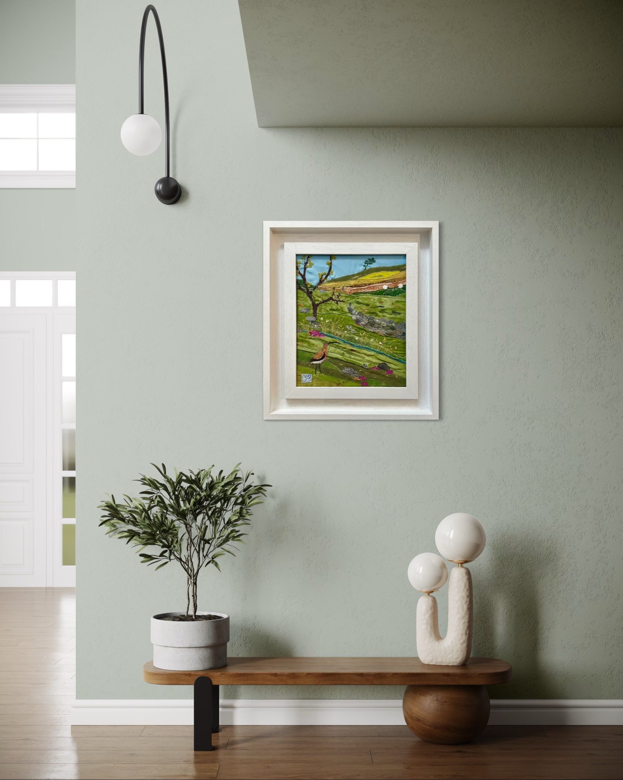 framed view of textile art of a curlew and a tree in a moorland landscape, by Jackie Gale, available through Wildwood Art gallery on Dartmoor.